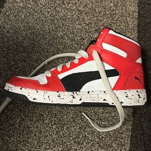 White, Red, and black Puma